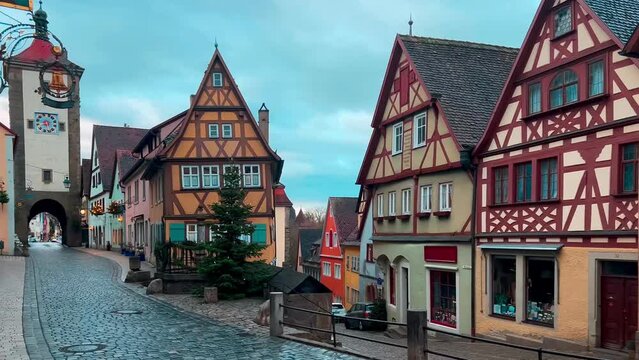 Street decorated for New Year and Christmas Market in Rothenburg ob der Tauber, Bavaria, Germany December 22, 2022. High quality 4k footage. High quality 4k footage