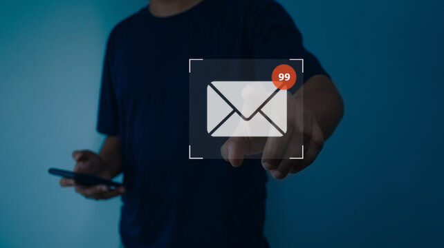 Businessman using smart phone with virtual new email notification alert concept for business e-mail communication and digital marketing. Inbox receiving electronic message alert, internet technology.