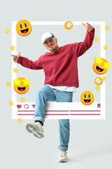 Dancing young male blogger on light background