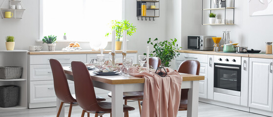 Served dining table in modern kitchen