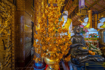 Beautiful Wat Buddhist temples in Chiangmai Chiang mai Thailand. Decorated in beautiful ornate colours of red and Gold and Blue. Lovely sunset