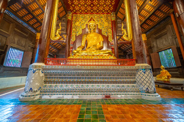 Beautiful Wat Buddhist temples in Chiangmai Chiang mai Thailand. Decorated in beautiful ornate colours of red and Gold and Blue. Lovely sunset