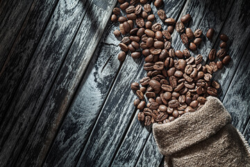 Roasted Coffee Beans Of Arabika On Vintage Background.