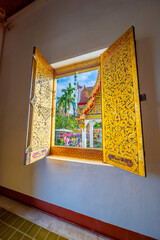 Beautiful Wat Buddhist temples in Chiangmai Chiang mai Thailand. Decorated in beautiful ornate colours of red and Gold and Blue. Lovely sunset
