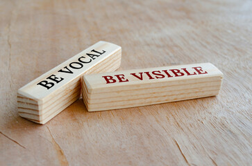Be vocal and visible text on wooden blocks. Business concept