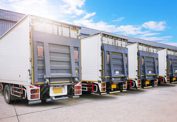 Container Trucks on The Parking Lot at Warehouse. Lifting Ramp Trucks. Commercial Truck Transport...