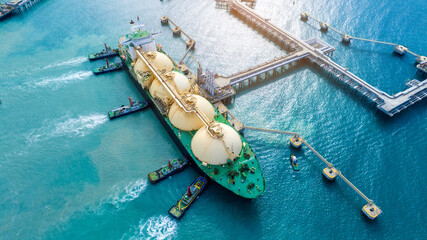 LNG (Liquefied natural gas) tanker anchored in Gas terminal gas tanks for storage. Oil Crude Gas...