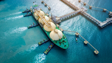 LNG (Liquefied natural gas) tanker anchored in Gas terminal gas tanks for storage. Oil Crude Gas...