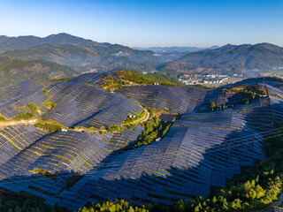 Aerial photography of solar photovoltaic panels on the mountain