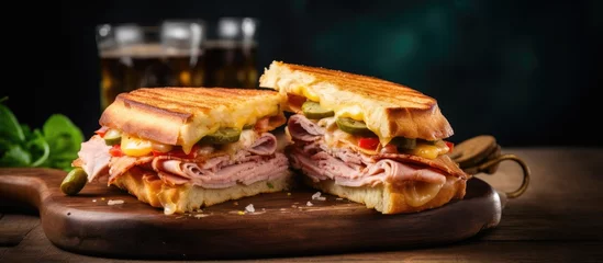 Tuinposter Classic Cuban sandwich on a board with cheese, ham, and fried pork. © AkuAku