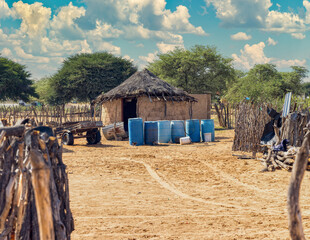 african village traditional houses in southern africa, donkey cart to carry water