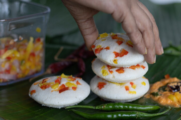 Savory bell pepper idly served on plantain leaf