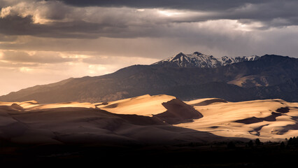 Sand Dunes in the Rocky Mountains of Colorado in the Spring. There is lots of sand. This is a...