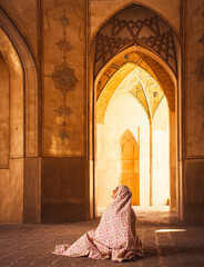 Kashan, Iran - 29th may, 2022: female Tourist wear special robe visit explore beautiful Agha Bozorg...