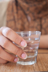 women holding a glass of water 