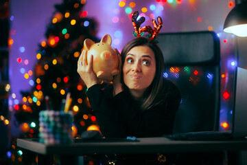 Unhappy Office Worker Having no Christmas Bonus in Piggy Bank. Stressed woman having money problems...