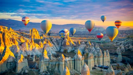 Zelfklevend Fotobehang Amazing panoramic view of sunrise Cappadocia landscape with colorful hot air balloons in the love valley- Travel destination concept Turkey © M.studio