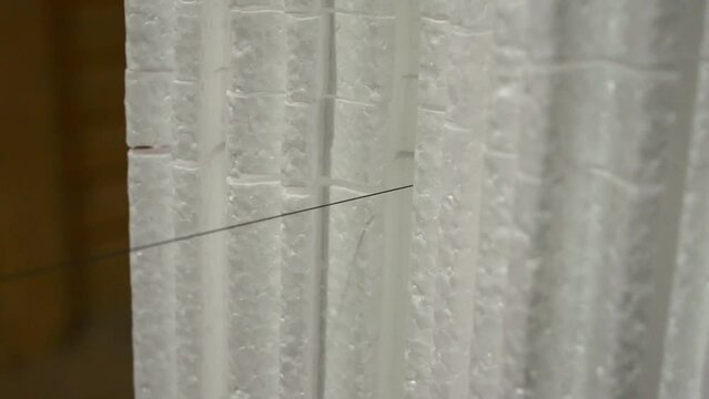 Hot wire cutting of foam plastic