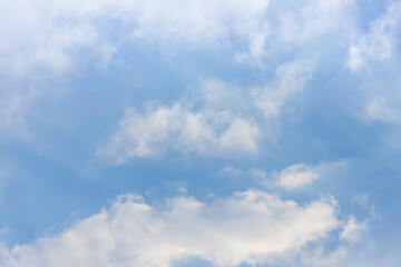 Clouds scattered like cotton candy in the blue sky