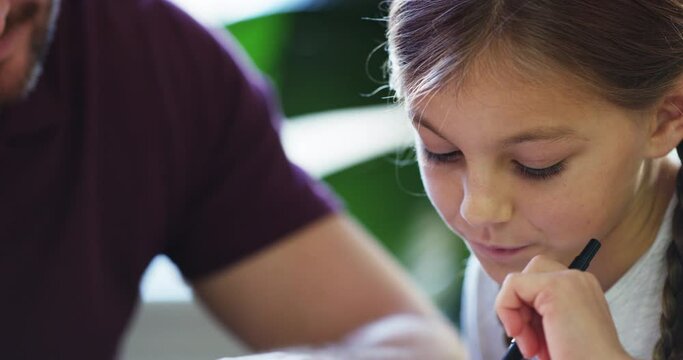 Hands, notebook and man help girl with homework, education and learning with reading and studying at home. School, student and father with daughter, family and bonding with book and tutoring lesson