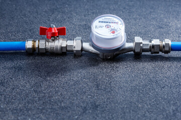  Water meter. Sanitary equipment. Water pipe, valve and water meter. Place for text.