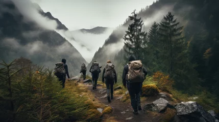 Fotobehang Mountain hikers carrying backpack carriers, climbing rocky mountain peaks. © Muamanah