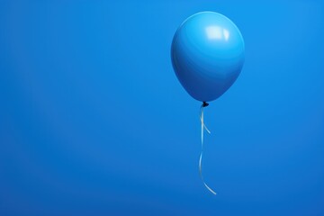 Single blue balloon floating against clear sky. Minimalistic design and simplicity.