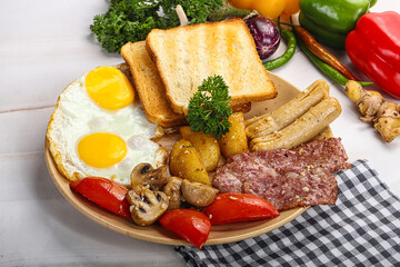 English breakfast with toast, egg and sausages