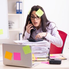 Young female employee in conflicting priorities concept