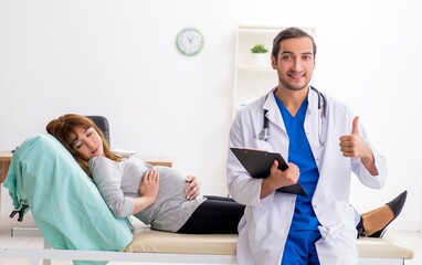 Young woman visting young male doctor gynecologist