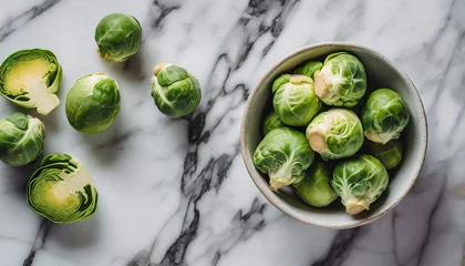 Keuken spatwand met foto Top view of a brussels sprouts in a solid white marble background  copy space © RupaDesign