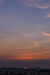 Sunset in Bangkok, Thailand, silhouette of big building in city with dramatic vanilla sky for background.