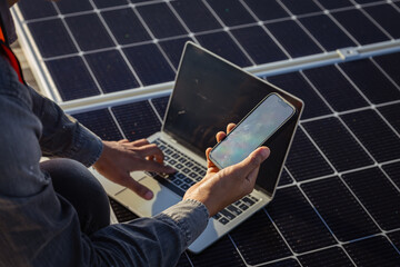 Close-up of young engineer hand is examining sun operation and cleanness of photovoltaic solar...