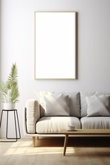 Interior of a living room in minimalist style with white empty picture frame for mockup, hanging over the sofa, table and houseplant