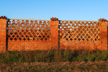 Ancient farmhouse ruin columns roof bricks uninhabited