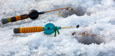 Fishing rod on ice in winter. Ice fishing