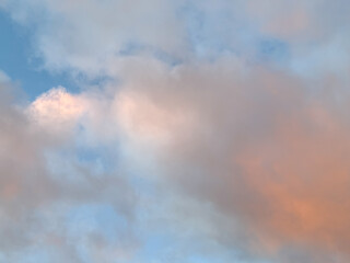 Naklejka na ściany i meble Colorful clouds at sunset. Background