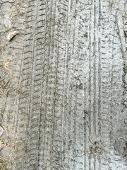 A wheel mark in the dirt. Background