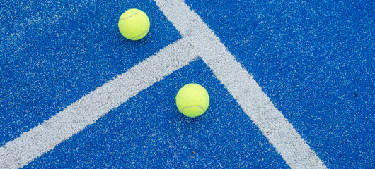 blue paddle tennis court and balls, racket sports courts concept - obrazy, fototapety, plakaty