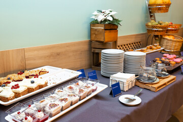 Assorted Breakfast Buffet Spread with Fresh Pastries and Fruits in hotel