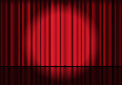Red curtain background. Spotlight on stage curtain. Theatrical drapes. Wavy velvet background.