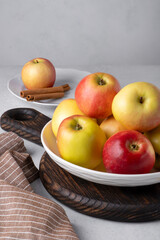 Naklejka na ściany i meble Beautiful ripe apples on a plate. Selective focus.