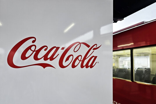 YUFUIN, JAPAN - NOVEMBER 12, 2023: Coca Cola sign on vending machine at Yufuin station. The Coca-Cola Company, American corporation founded in 1892.