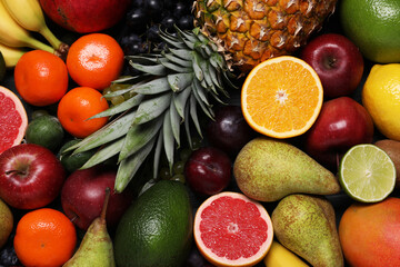 Different ripe fruits as background, top view