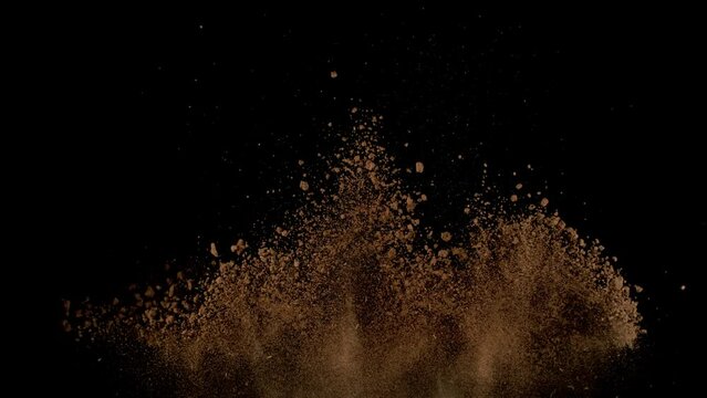 Super Slow Motion Shot of Soil Explosion Isolated on Black Background at 1000fps.