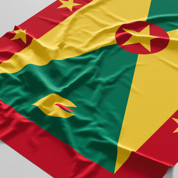Flag of Grenada. Fabric textured Grenada flag isolated on white background
