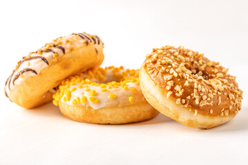 assorted glazed donuts on white surface