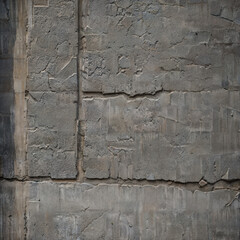 Alte Mauer aus Beton mit sichtbaren Verschleißerscheinungen und Rissen
