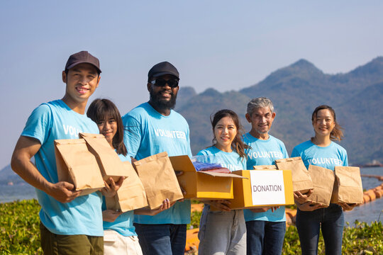 Diversity group of volunteer people joining together in money raising event for charity donation work and ngo related activity such as global warming, environmental issues, pollution concept