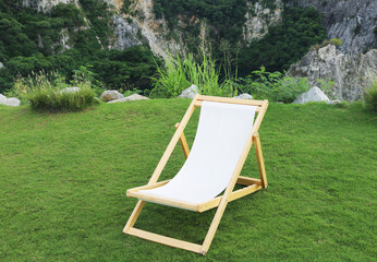 Garden deck chair on grass field.